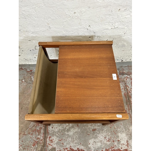 96 - A mid 20th century A. H. McIntosh & Co. Ltd teak and canvas magazine rack side table