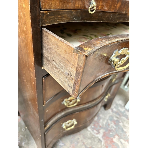 99 - A Georgian style mahogany serpentine chest of four drawers with brushing slide