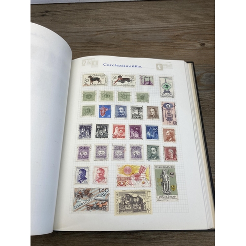 1411A - Three albums containing a collection of stamps and first day covers