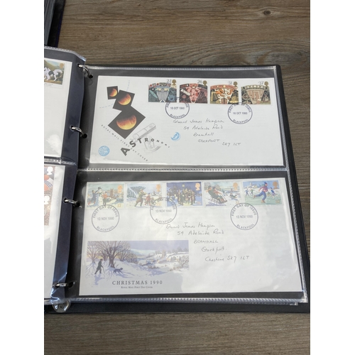 1411B - Three albums containing a collection of first day covers