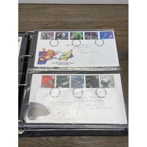 1411B - Three albums containing a collection of first day covers