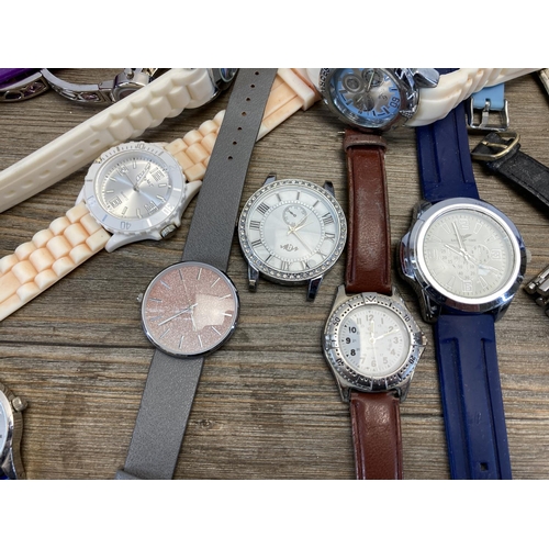 1420 - A collection of women's and men's quartz wristwatches to include Lipsy of London etc.