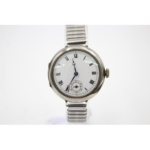 2502 - A hallmarked .925 silver trench style mechanical men's wristwatch