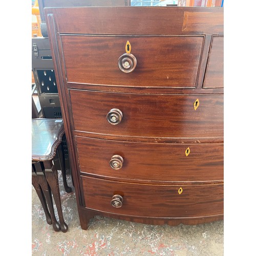 1 - A Georgian mahogany bow fronted chest of two short over three long drawers