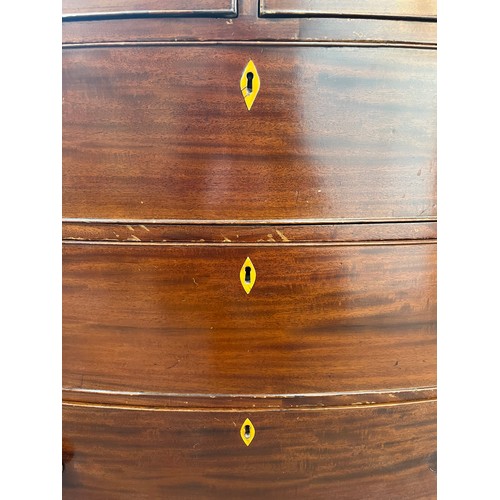 1 - A Georgian mahogany bow fronted chest of two short over three long drawers