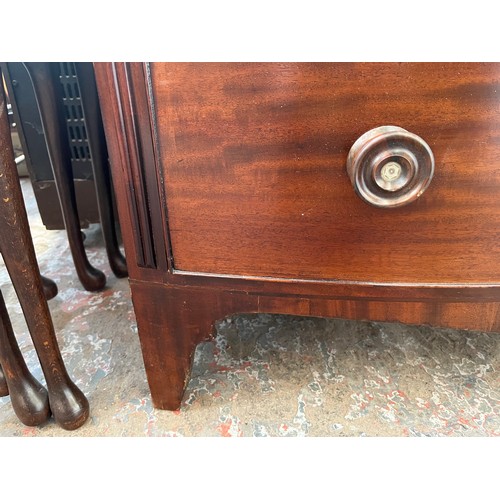 1 - A Georgian mahogany bow fronted chest of two short over three long drawers