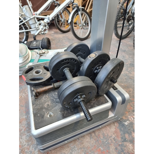 286 - An Exercise Express vibration workout machine together with a pair of dumbbells and various weights