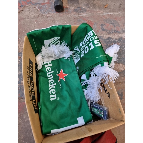 293A - A box containing Heineken Rubgy World Cup 2015 scarves and two vintage cased pairs of crown green bo... 