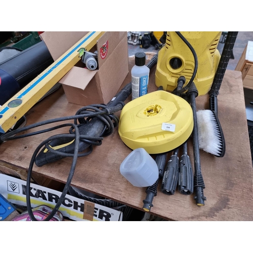 334 - A collection of tools and garden accessories to include Kärcher K2 240v pressure washer, hedge trimm... 