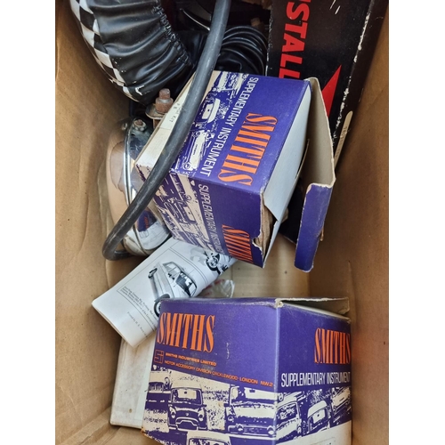 336 - A collection of car parts to include vintage boxed Smiths oil gauge kit, Tungsten Iodine spotlights,... 