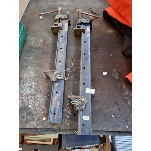 355 - A pair of cast iron sash clamps