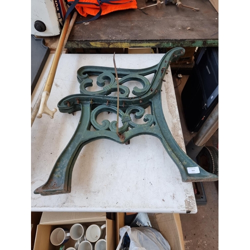 359 - A pair of cast iron garden bench ends