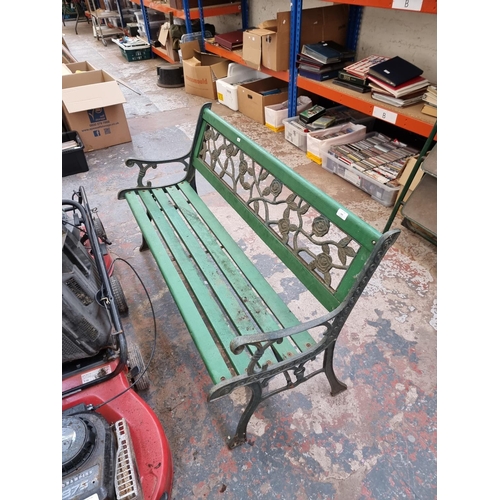 368 - A cast iron and wooden slatted garden bench