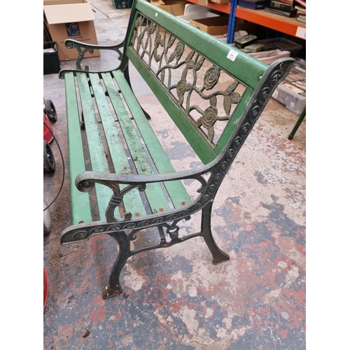 368 - A cast iron and wooden slatted garden bench