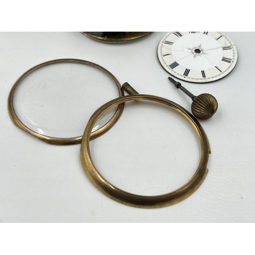 2497 - A collection of pocket watch parts to include four movements with dials, white metal Albert chain, A... 