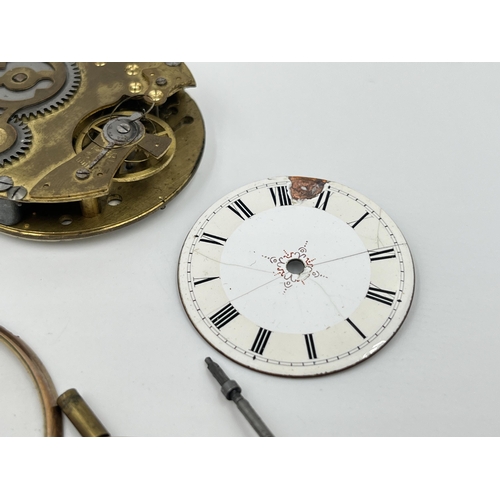 2497 - A collection of pocket watch parts to include four movements with dials, white metal Albert chain, A... 