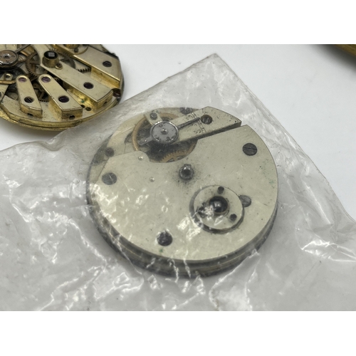 2497 - A collection of pocket watch parts to include four movements with dials, white metal Albert chain, A... 