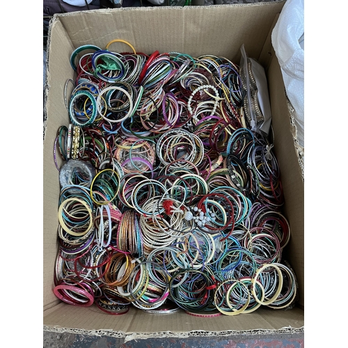 419 - A box containing a large quantity of stacking bangles