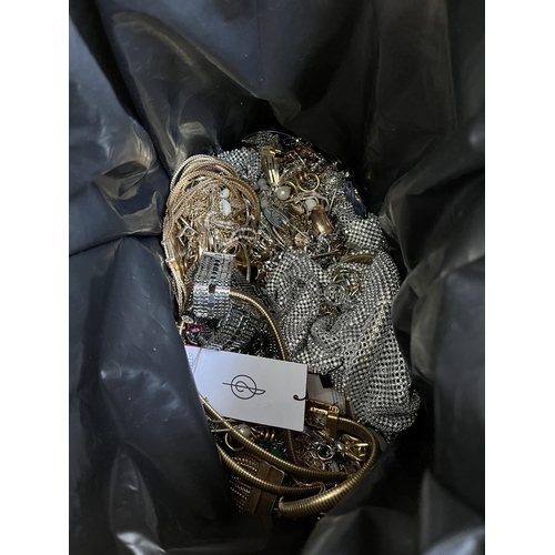 420 - A bag containing a large quantity of costume jewellery