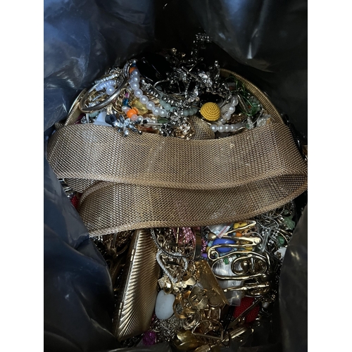 422 - A bag containing a large quantity of costume jewellery