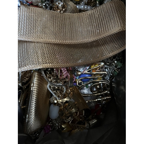 422 - A bag containing a large quantity of costume jewellery