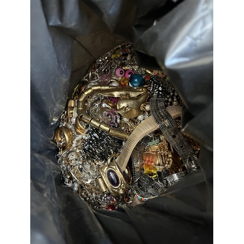 423 - A bag containing a large quantity of costume jewellery