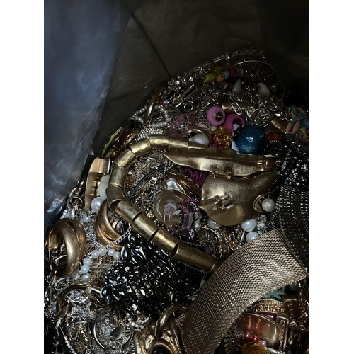 423 - A bag containing a large quantity of costume jewellery