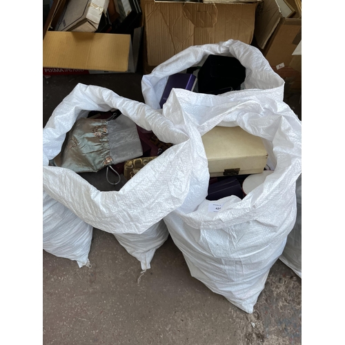 424 - Three bags containing a large quantity of empty jewellery boxes and bags