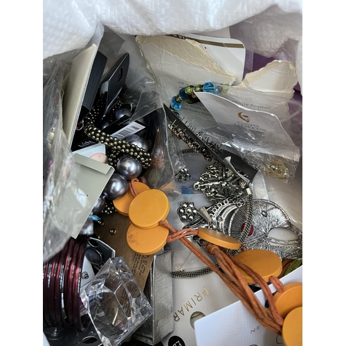 425 - A bag containing a large quantity of costume jewellery