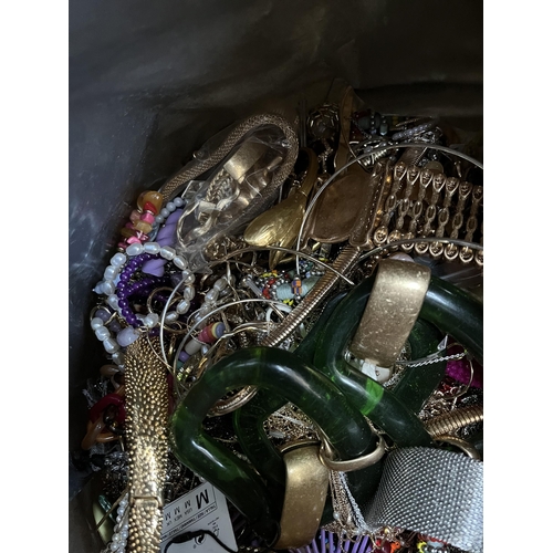 427 - A bag containing a large quantity of costume jewellery