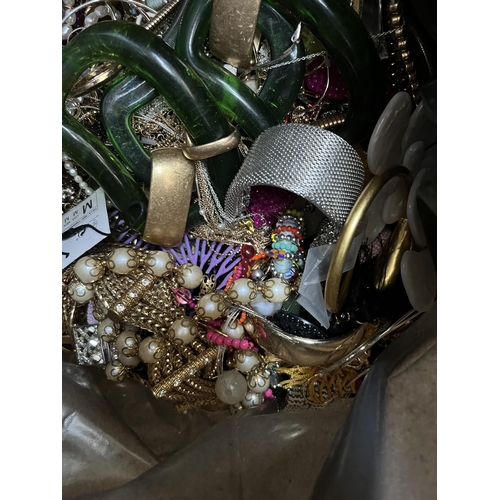 427 - A bag containing a large quantity of costume jewellery