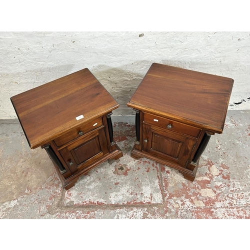 201 - A pair of French Empire style mahogany bedside cabinets