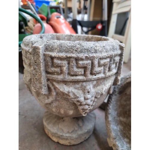 383 - A pair of cast stone planters on pedestal base