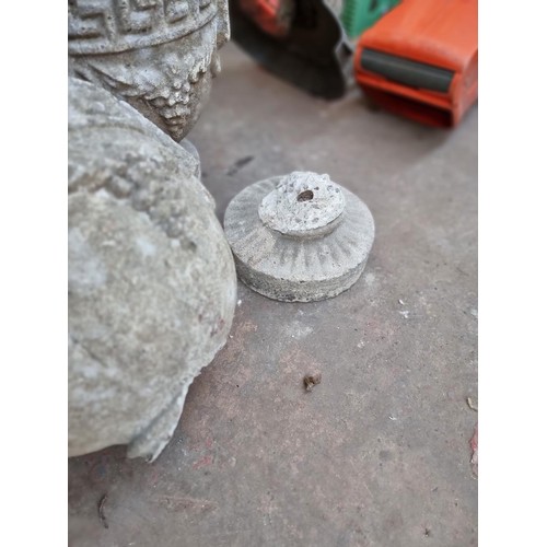 383 - A pair of cast stone planters on pedestal base