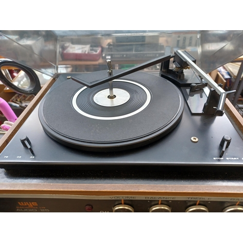 591 - Three items of vintage hi-fi, one WYE Electronics Ltd Audio 25 three-speed record player, one Rotel ... 