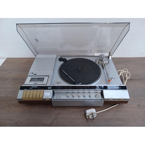 600 - A Sharp SG-280 stereo music centre comprising 
two-speed turntable, three-band tuner/amplifier and D... 