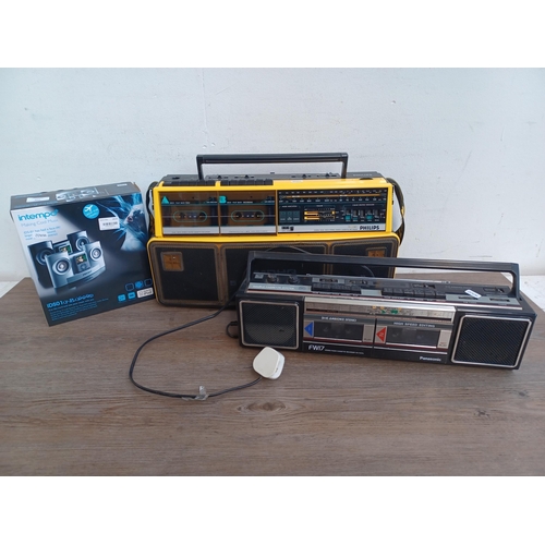 602 - Three items, one Philips D8304 portable three-band radio/twin cassette player, one Panasonic RX-FW17... 