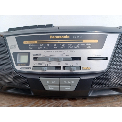 603 - Two items, one Panasonic RX-DS12 portable two-band radio/cassette deck/CD player and one Pure 
Evoke... 