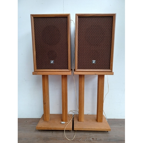 605 - A pair of vintage Sanyo hi-fi speakers with stands with spikes