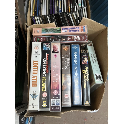 400 - Seven boxes containing a large quantity of CDs and VHS tapes