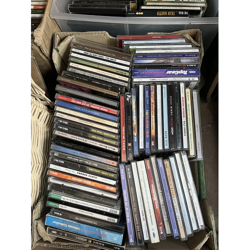 400 - Seven boxes containing a large quantity of CDs and VHS tapes