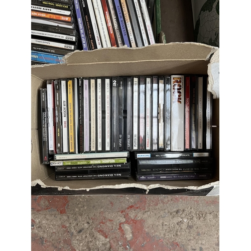 400 - Seven boxes containing a large quantity of CDs and VHS tapes