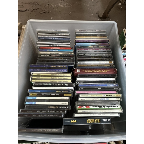 400 - Seven boxes containing a large quantity of CDs and VHS tapes