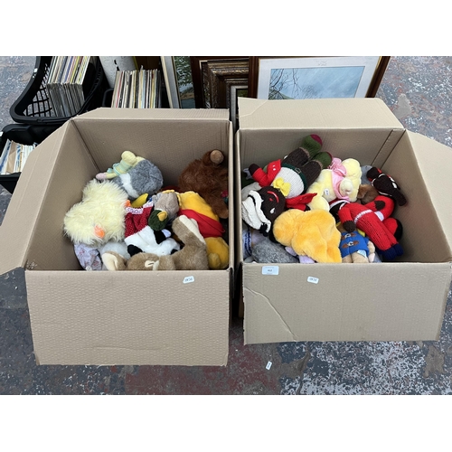 412 - Two boxes containing a large quantity of soft toys