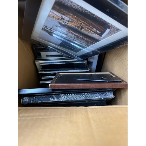 403 - Seven boxes containing railway books, picture frames, ceramic mugs etc.