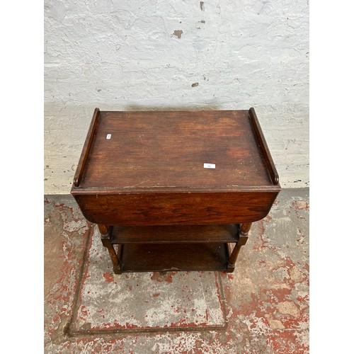 168 - A mid 20th century oak drop leaf three tier tea trolley