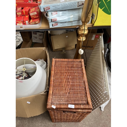 428 - Seven boxes and one wicker laundry basket containing photo frames, gold painted standard lamp, ceram... 