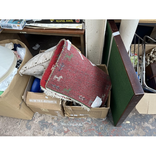 428 - Seven boxes and one wicker laundry basket containing photo frames, gold painted standard lamp, ceram... 