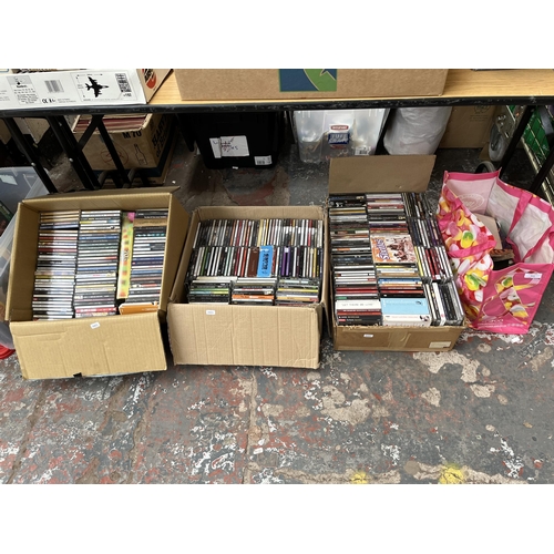 433 - Eight boxes and one bag containing a large quantity of CDs, DVDs, records and VHS tapes