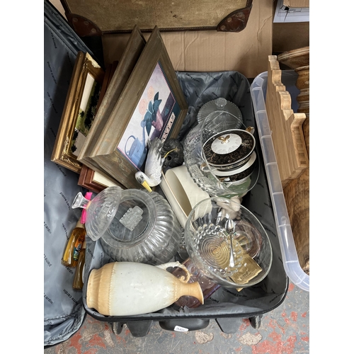 438 - Three boxes and two suitcases containing glass candle holders, treenware, glassware etc.